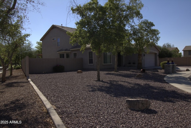 8920 S 40th Ln, Laveen, AZ 85339 - traditional-style house with a garage and stucco siding