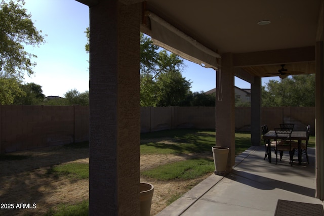 8920 S 40th Ln, Laveen, AZ 85339 - fenced backyard with a patio, ceiling fan, and outdoor dining space