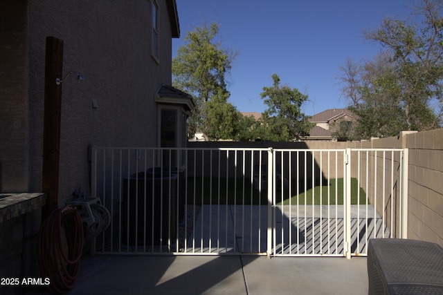 8920 S 40th Ln, Laveen, AZ 85339 - view of patio / terrace featuring a gate