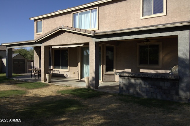8920 S 40th Ln, Laveen, AZ 85339 - back of house featuring a patio area and stucco siding