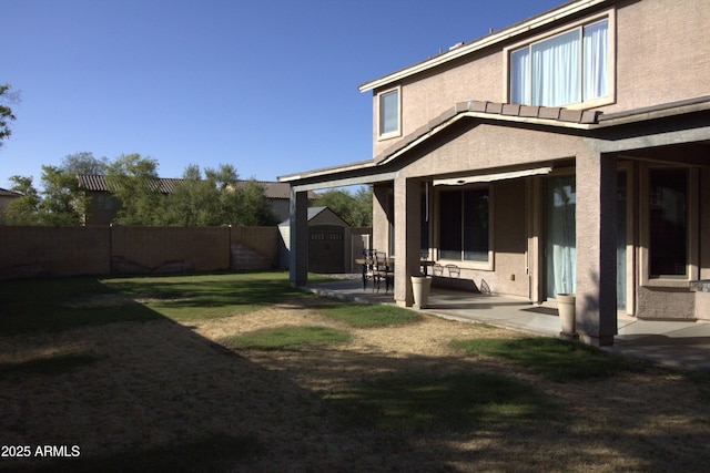 8920 S 40th Ln, Laveen, AZ 85339 - back of house with stucco siding and a patio