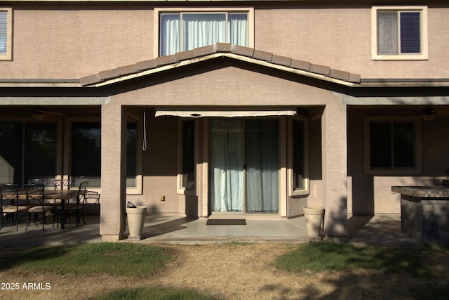 8920 S 40th Ln, Laveen, AZ 85339 - back of house with stucco siding, a patio, and a ceiling fan