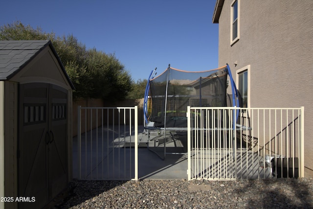 8920 S 40th Ln, Laveen, AZ 85339 - fenced yard with a trampoline