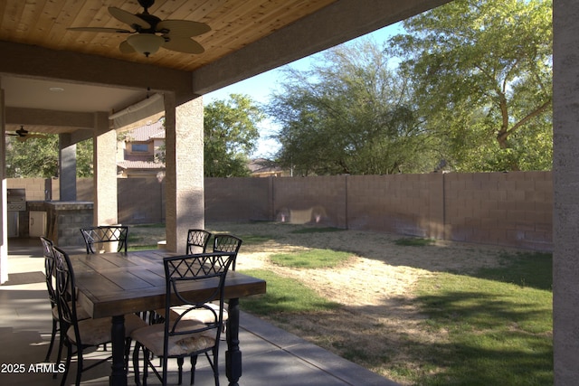8920 S 40th Ln, Laveen, AZ 85339 - fenced backyard featuring a ceiling fan, a patio, and outdoor dining space