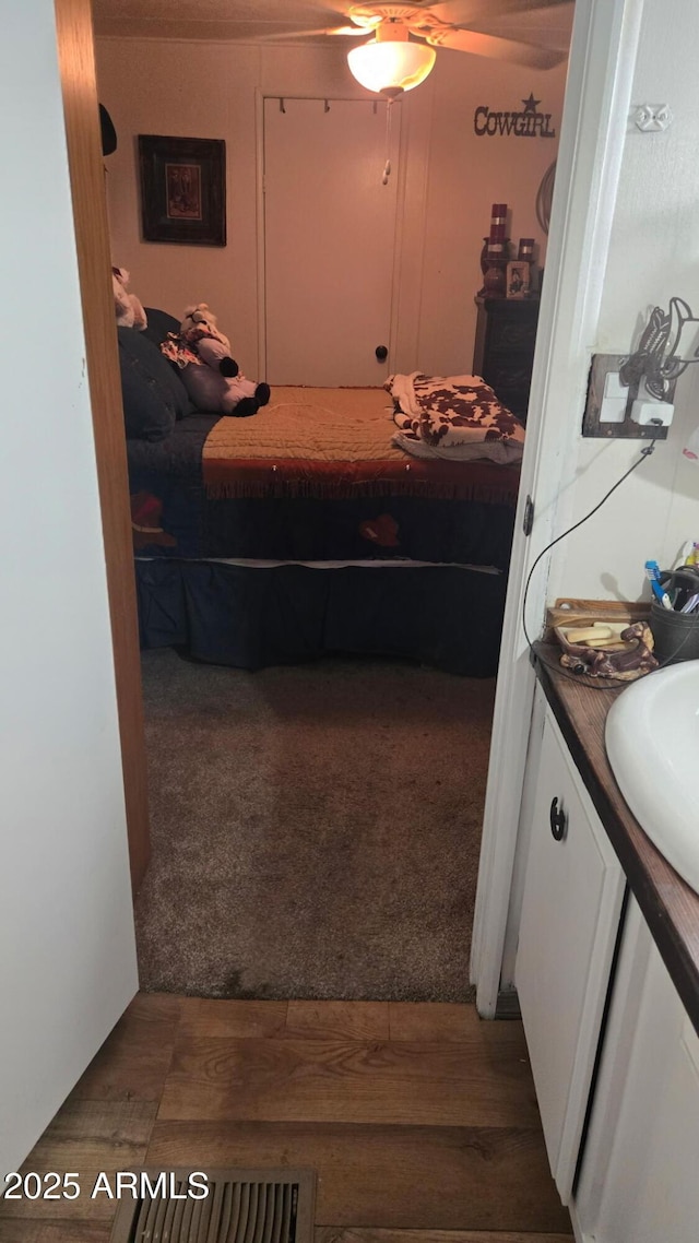8920 S 40th Ln, Laveen, AZ 85339 - bedroom with wood finished floors and carpet flooring