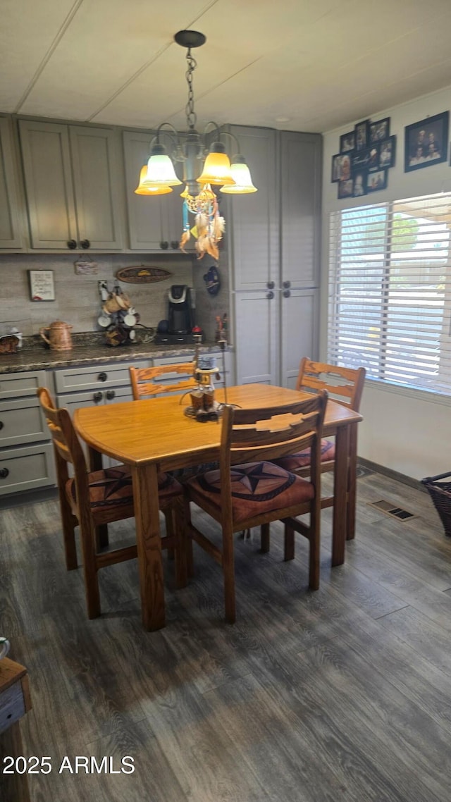 8920 S 40th Ln, Laveen, AZ 85339 - dining room with dark wood finished floors and a chandelier
