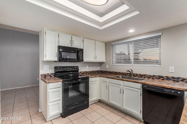 kitchen with white cabinetry, light tile patterned flooring, black appliances, and sink