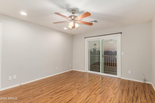 unfurnished room with light wood-type flooring and ceiling fan