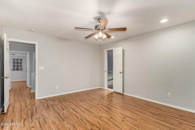 unfurnished room featuring light hardwood / wood-style floors and ceiling fan