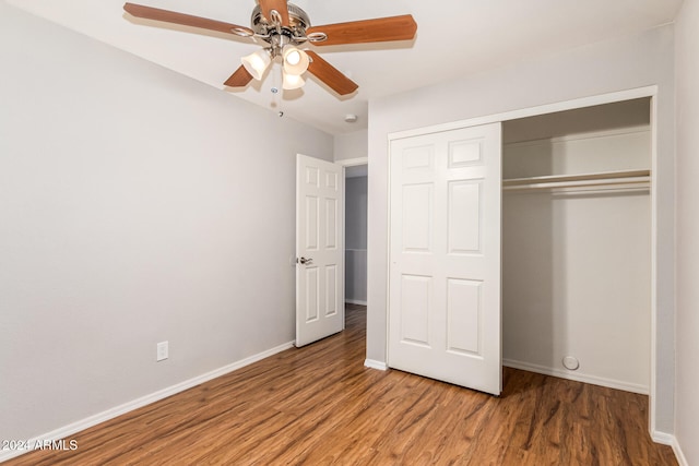 unfurnished bedroom featuring a closet, ceiling fan, and hardwood / wood-style flooring