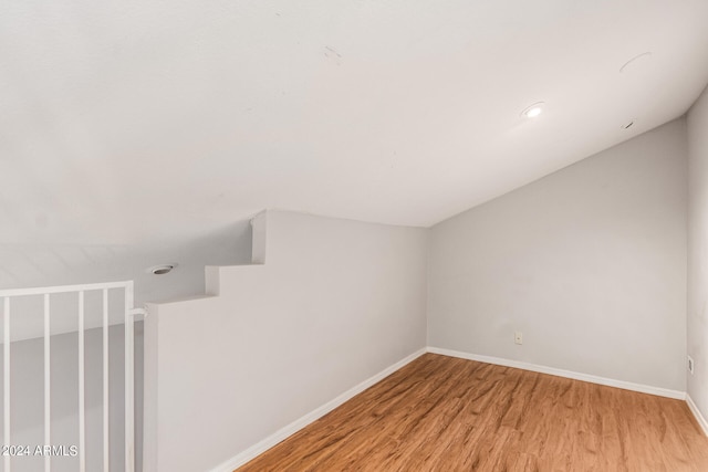 bonus room with light wood-type flooring