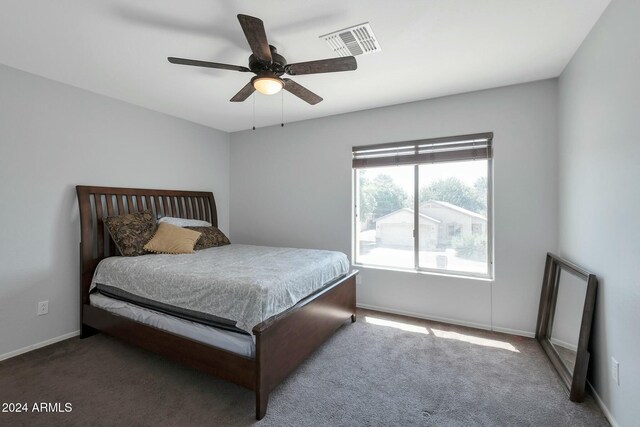 962 W Lindbergh Ave, Coolidge, AZ 85128 - bedroom with dark colored carpet and ceiling fan