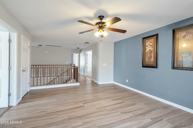 962 W Lindbergh Ave, Coolidge, AZ 85128 - empty room featuring ceiling fan and light hardwood / wood-style flooring