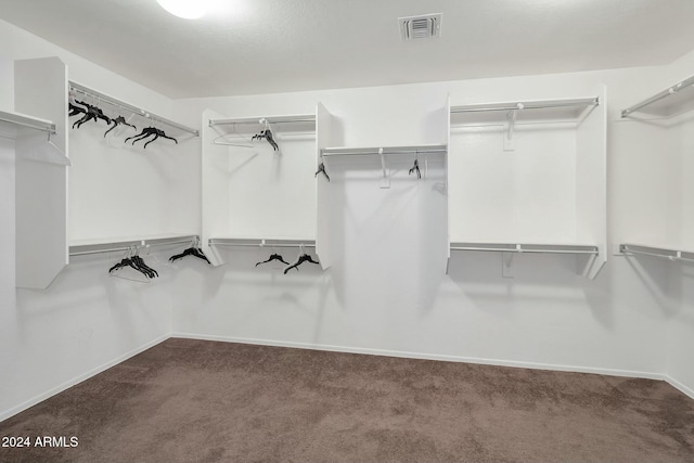 962 W Lindbergh Ave, Coolidge, AZ 85128 - walk in closet featuring dark carpet