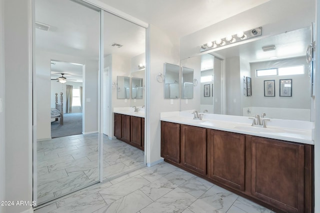 962 W Lindbergh Ave, Coolidge, AZ 85128 - bathroom featuring a wealth of natural light, vanity, and ceiling fan