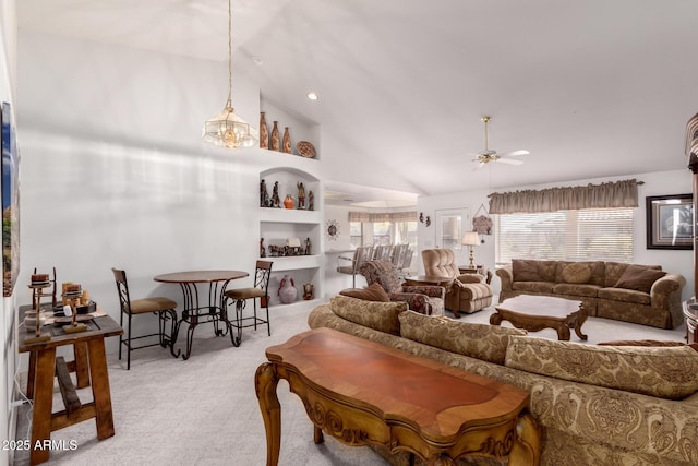 living room featuring high vaulted ceiling, light carpet, and ceiling fan