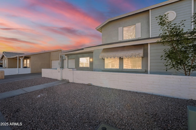 view of property exterior at dusk