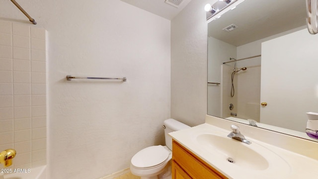 bathroom with visible vents, toilet, bathtub / shower combination, and vanity