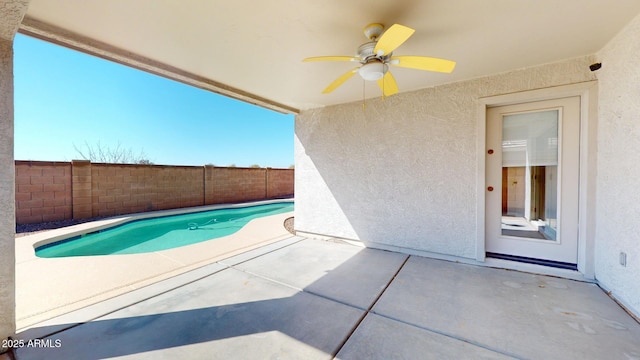 view of swimming pool with a fenced in pool, a patio, ceiling fan, and fence