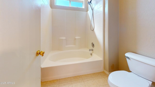 bathroom with tile patterned floors, toilet, and shower / bathtub combination