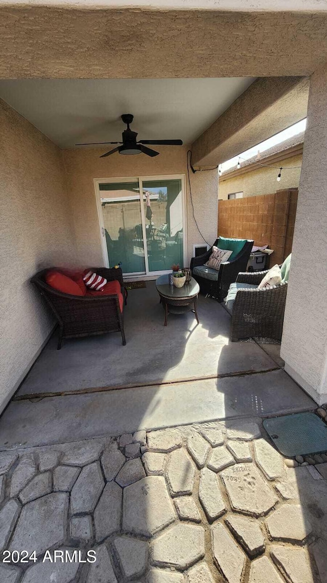 view of patio / terrace with an outdoor living space and ceiling fan