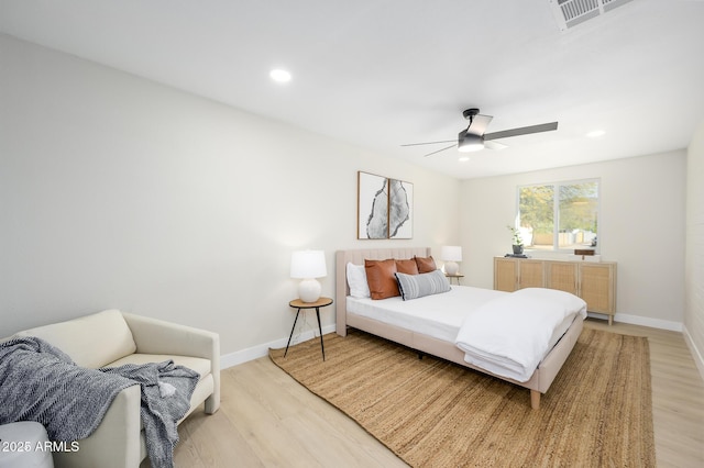 bedroom featuring ceiling fan and light hardwood / wood-style flooring