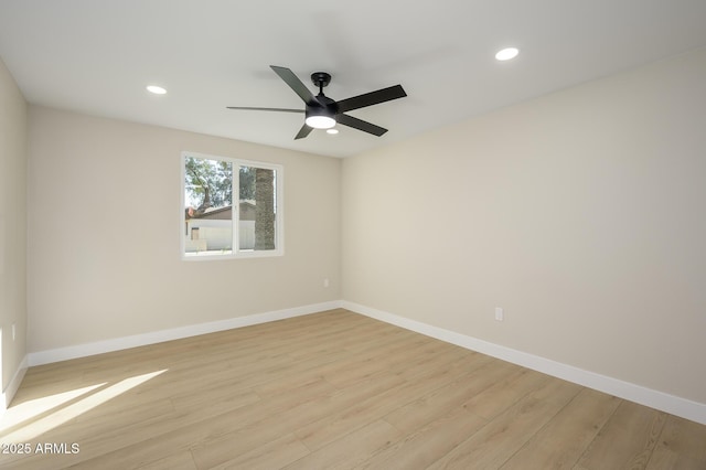 unfurnished room featuring ceiling fan and light hardwood / wood-style flooring