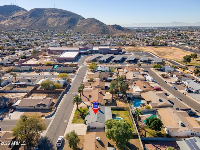 birds eye view of property with a mountain view