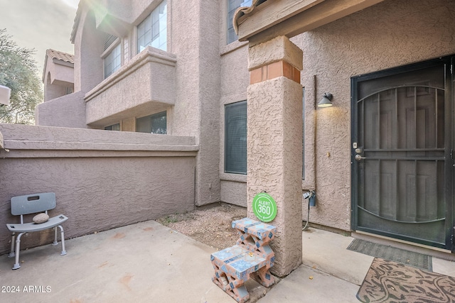 property entrance with a patio area