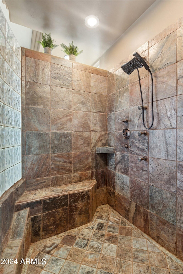 bathroom featuring tiled shower