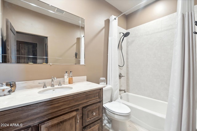 full bathroom with shower / bath combo, toilet, and vanity