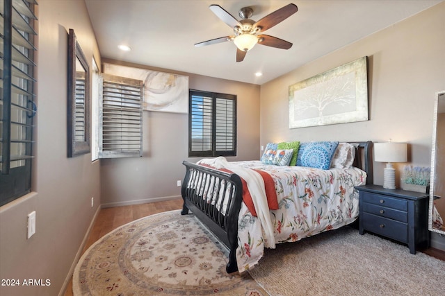 bedroom featuring hardwood / wood-style floors and ceiling fan