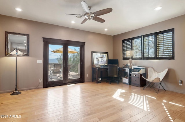 office space featuring ceiling fan and light hardwood / wood-style flooring