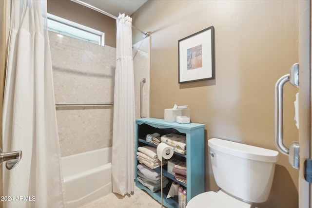 bathroom with shower / bath combo with shower curtain and toilet