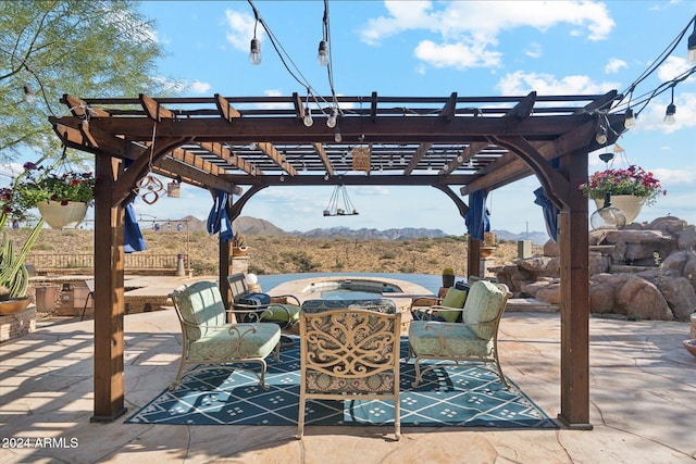 view of patio featuring a mountain view and a pergola