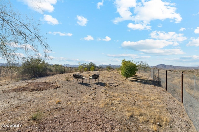 view of yard featuring a mountain view and a rural view