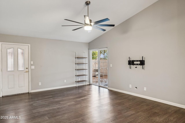 spare room featuring ceiling fan, high vaulted ceiling, dark wood finished floors, and baseboards