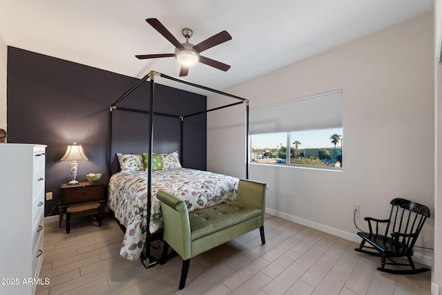 bedroom with ceiling fan and light hardwood / wood-style flooring