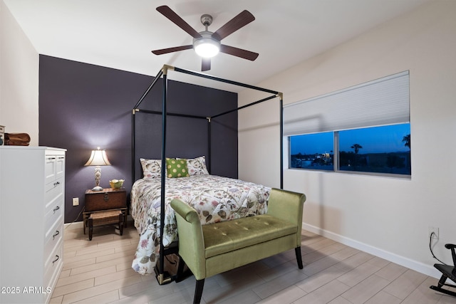 bedroom with light hardwood / wood-style floors and ceiling fan