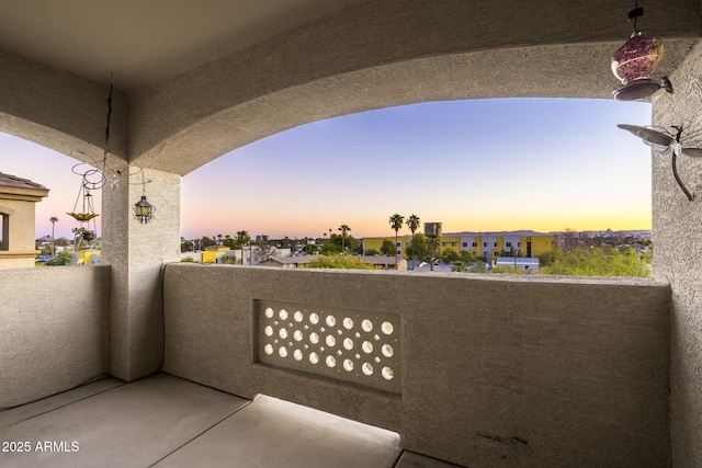 view of balcony at dusk