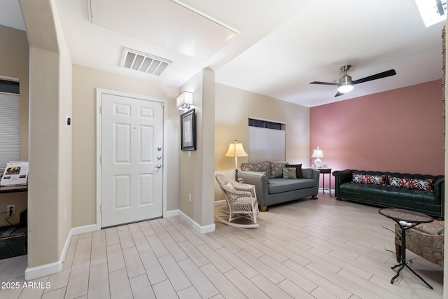 foyer with light hardwood / wood-style floors and ceiling fan