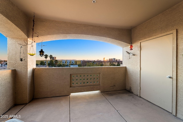 view of balcony at dusk