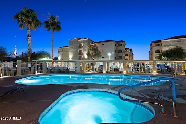 view of pool at dusk