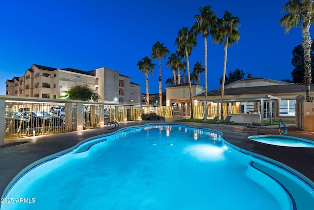 view of pool at night