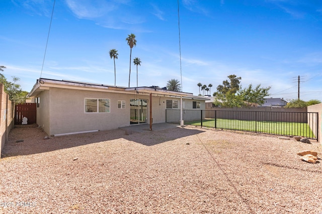 6714 N 26th Dr, Phoenix, AZ 85017 - rear view of house with a fenced backyard, stucco siding, and a patio area