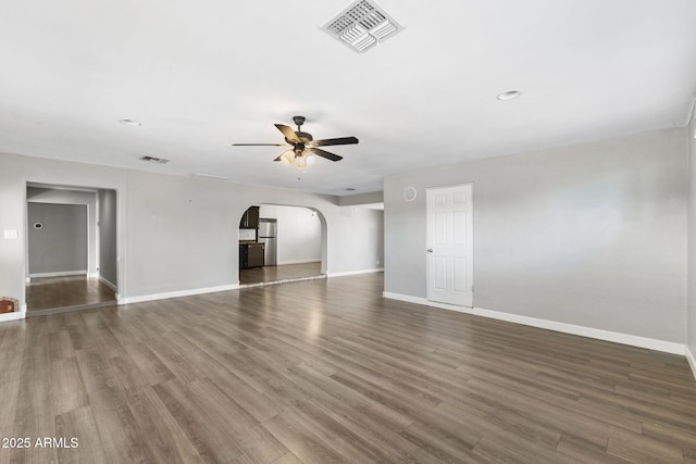 6714 N 26th Dr, Phoenix, AZ 85017 - empty room featuring arched walkways, ceiling fan, baseboards, and visible vents