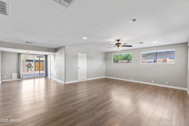 6714 N 26th Dr, Phoenix, AZ 85017 - unfurnished living room with visible vents, baseboards, and ceiling fan
