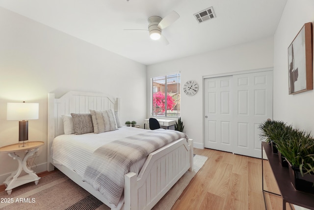 11500 E Cochise Dr Unit 1015, Scottsdale, AZ 85259 - bedroom featuring visible vents, light wood-style floors, ceiling fan, and baseboards