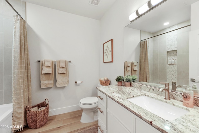 11500 E Cochise Dr Unit 1015, Scottsdale, AZ 85259 - bathroom featuring visible vents, wood finished floors, baseboards, vanity, and toilet