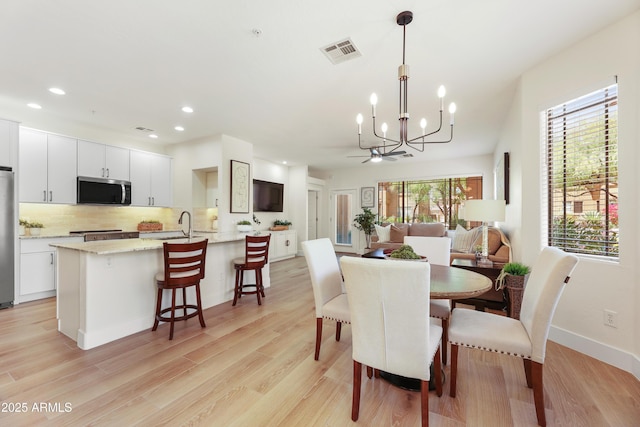 11500 E Cochise Dr Unit 1015, Scottsdale, AZ 85259 - dining room with recessed lighting, light wood-type flooring, a chandelier, and visible vents